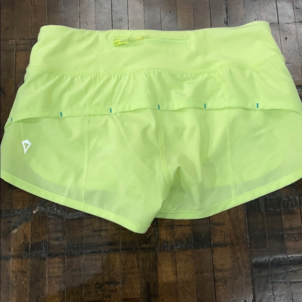 Girls Adorable bright yellow Ivivva shorts.